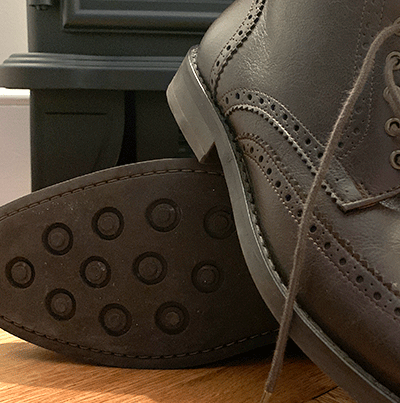 studded rubber soles on brown brogue boots